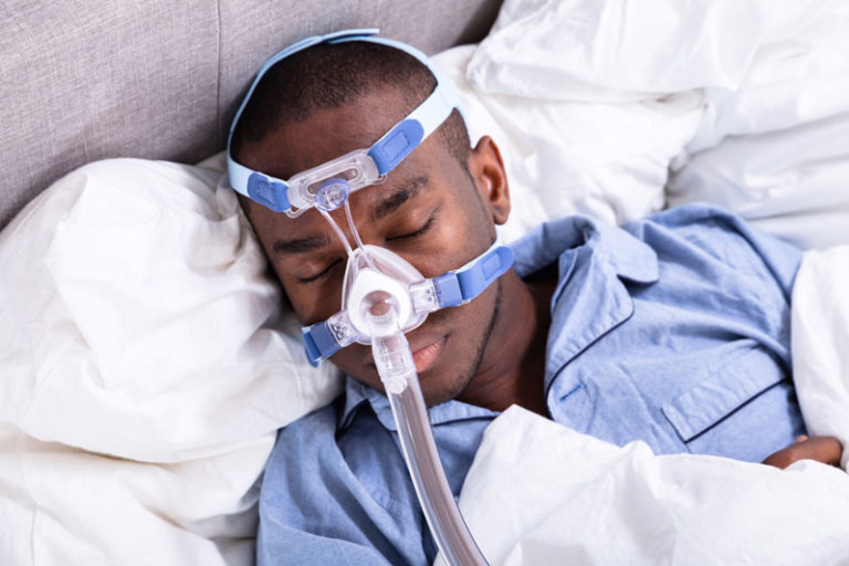 Model wearing CPAP | Pristine Sleep Services